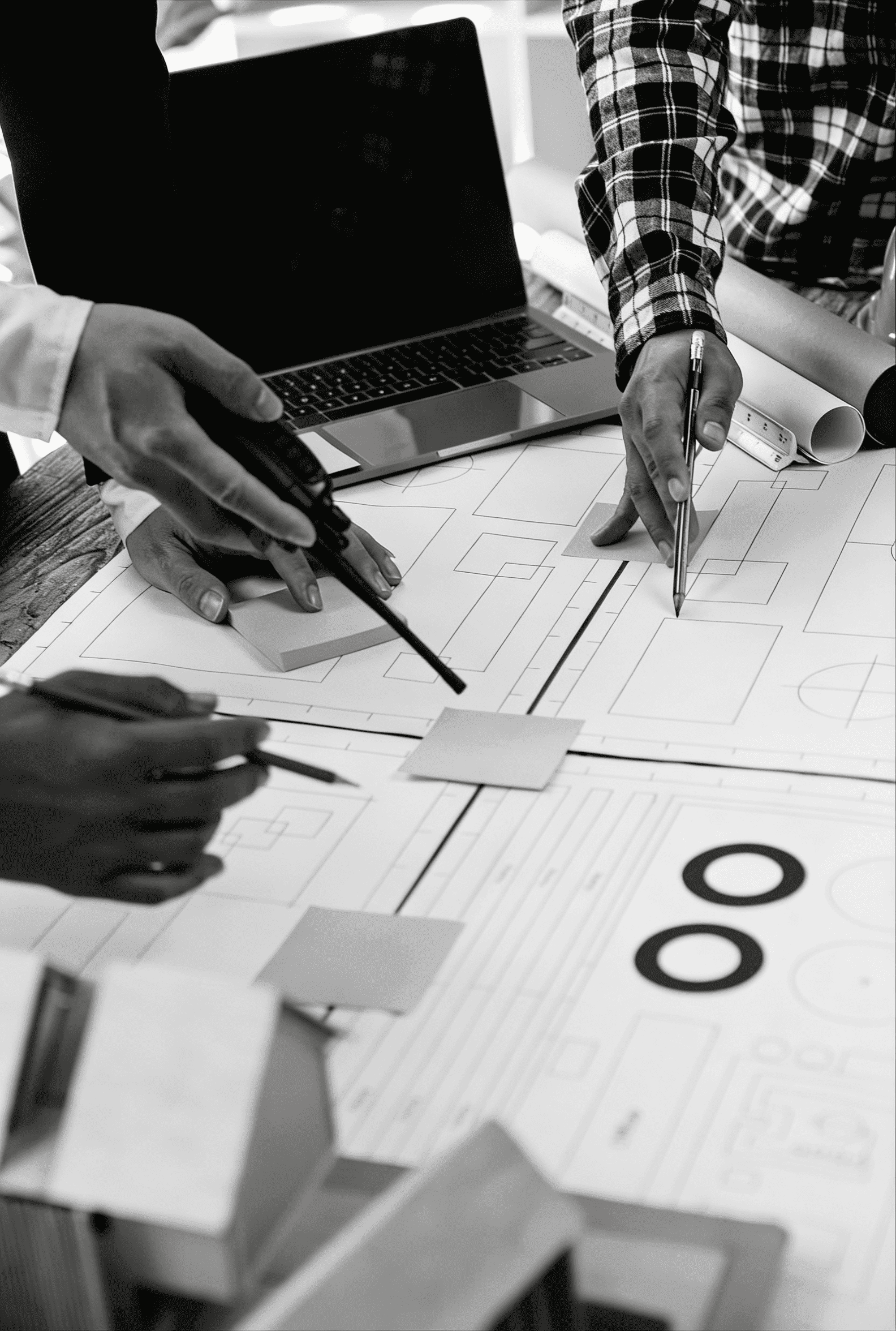 Strategic advisory planning session with documents and diagrams